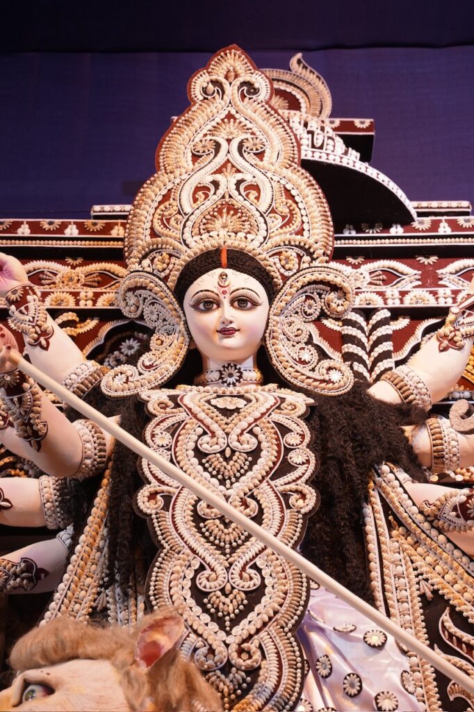 Inauguration ceremony of Young Boys Club celebrating 54th Year of Durga Puja with the theme ‘Devi Durga - The Power of Universe’ where 32 feet Durga Idol is placed outside Pandal with ten globes in her ten hands symbolizing 'Vasudhaiva Kutumbakam' - The World is one family