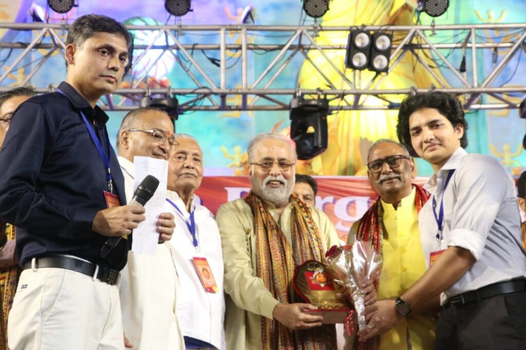Inauguration ceremony of Young Boys Club celebrating 54th Year of Durga Puja with the theme ‘Devi Durga - The Power of Universe’ where 32 feet Durga Idol is placed outside Pandal with ten globes in her ten hands symbolizing 'Vasudhaiva Kutumbakam' - The World is one family