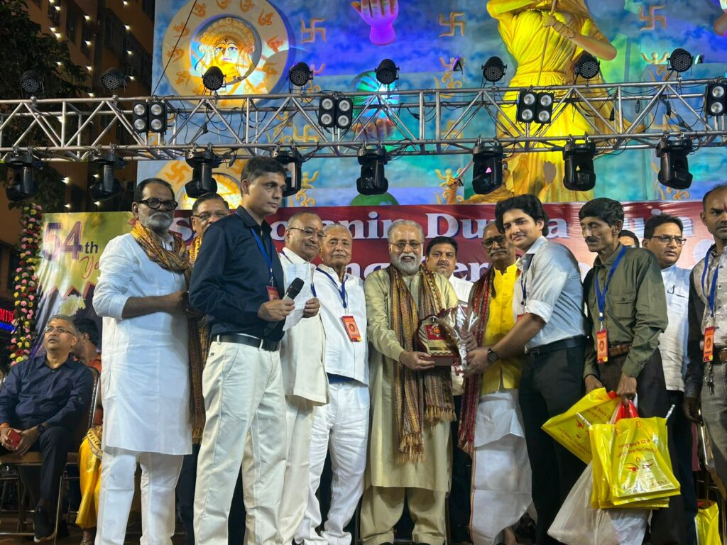 Inauguration ceremony of Young Boys Club celebrating 54th Year of Durga Puja with the theme ‘Devi Durga - The Power of Universe’ where 32 feet Durga Idol is placed outside Pandal with ten globes in her ten hands symbolizing 'Vasudhaiva Kutumbakam' - The World is one family