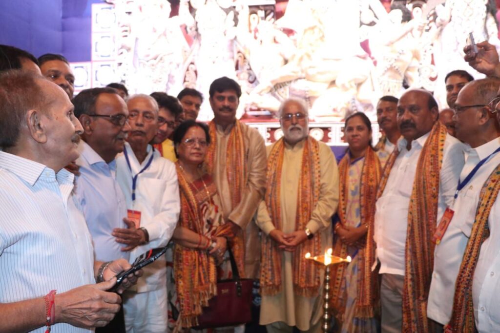 Inauguration ceremony of Young Boys Club celebrating 54th Year of Durga Puja with the theme ‘Devi Durga - The Power of Universe’ where 32 feet Durga Idol is placed outside Pandal with ten globes in her ten hands symbolizing 'Vasudhaiva Kutumbakam' - The World is one family