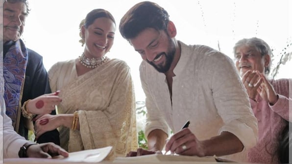 Netizens shower love and blessings on the newly wedded Sonakshi and Zaheer as they make their first public appearance at their star-studded reception The moment we have all been waiting for is finally here! Sonakshi Sinha and Zaheer Iqbal made their romance official in an intimate ceremony that took place yesterday, Sunday, June 23, 2024, in Mumbai. The celebration began with an intimate registered marriage, followed by a wedding party for friends and colleagues from the film industry. As per reports some 1000 guests were expected to arrive at the lavish ceremony which was held at Bastian in Mumbai. Sonakshi's parents actor and politician Shatrughan Sinha and mother Poonam looked beautiful in the traditional attire. Joining the couple's family were their friends from the fraternity including Salman Khan, Anil Kapoor, Kajol, Huma Qureshi, Saqib Saleem, Chunky Panday, Vidya Balan and Siddharth Roy Kapur, Sonakshi’s Heeramnadi co-star Aditi Rao Hydari, Sanjeeda Shaikh and director Sanjay Leela Bhansali, Arbaaz Khan, Aditya Roy Kapur, Raveena Tandon. According to sources The white interiors of the restaurant were complimented with beautiful red flowers. "Guess that was the whole idea as the party invite read - Dress Code: Formal Festive, just don't wear red. The colour was exclusively meant for the bride who looked radiant in the red saree," As the two stepped out to pose for the shutterbugs, they won the hearts of the paparazzi as they sat with them for a group picture.Meanwhile, Zaheer complimented her in a white chikankari kurta while they signed the papers for their registered wedding. For the reception in the evening, Sonakshi stuck to her roots and opted for a bright red benarasi saree, gajra, and red bangles. While this look was simple, it has made a huge impact on the internet and netizens are absolutely in love. Not to mention, fans also loved that she opted for 'alta' instead of mehendi for this occasion and this wasn't just another lavish B-town wedding with the bride in pastels. Fashion Police Diet Sabya shared a video of Sonakshi's look and here's what netizens had to say. A user said, "Happiest, most uncurated bride in recent times," while another one said, "A shoutout for being an original bride Someone commented, "What a relief to see such a joyful ceremony without the unnecessary display of wealth and waste.”She is so much ahead of her times " - A person who appreciated her alta and was reminded of her character Pakhi from 'Lootera'. After many days of speculations this couple has finally made it official and we wish the newly wedded couple of Btown years of happiness and togetherness.