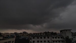 Dark rain clouds forming over Kolkata skyline ahead of predicted rainfall.