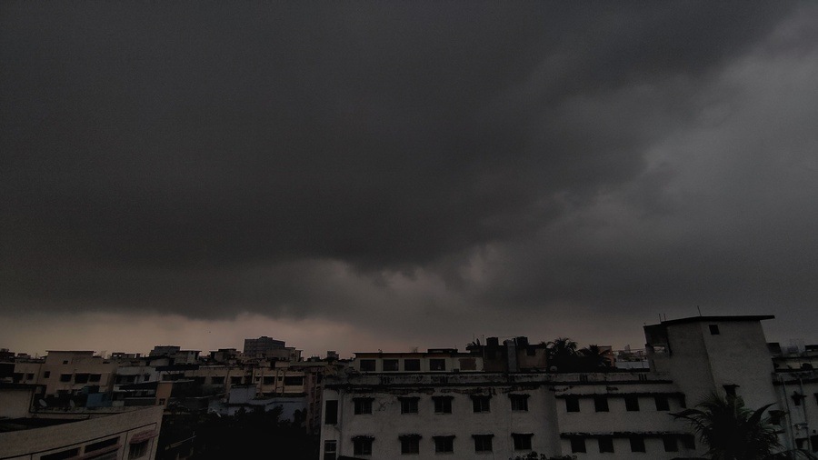 Dark rain clouds forming over Kolkata skyline ahead of predicted rainfall.
