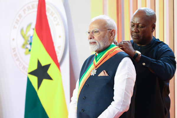 Narendra Modi with Ghanaian President receiving Officer of the Order of the Star of Ghana