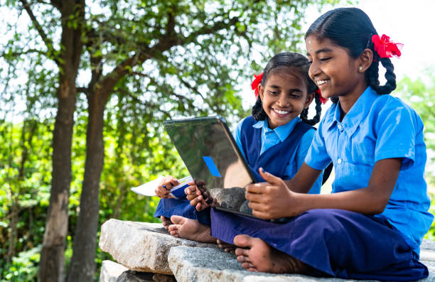 Young Indians accessing digital services in rural areas, reflecting India’s efforts to bridge the digital divide.