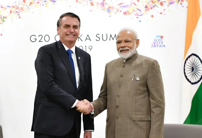 Leaders of India and Brazil engaging in a handshake